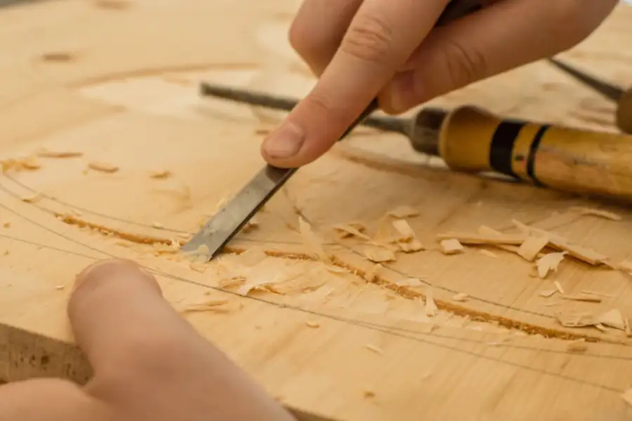 Carving wood with a chisel
